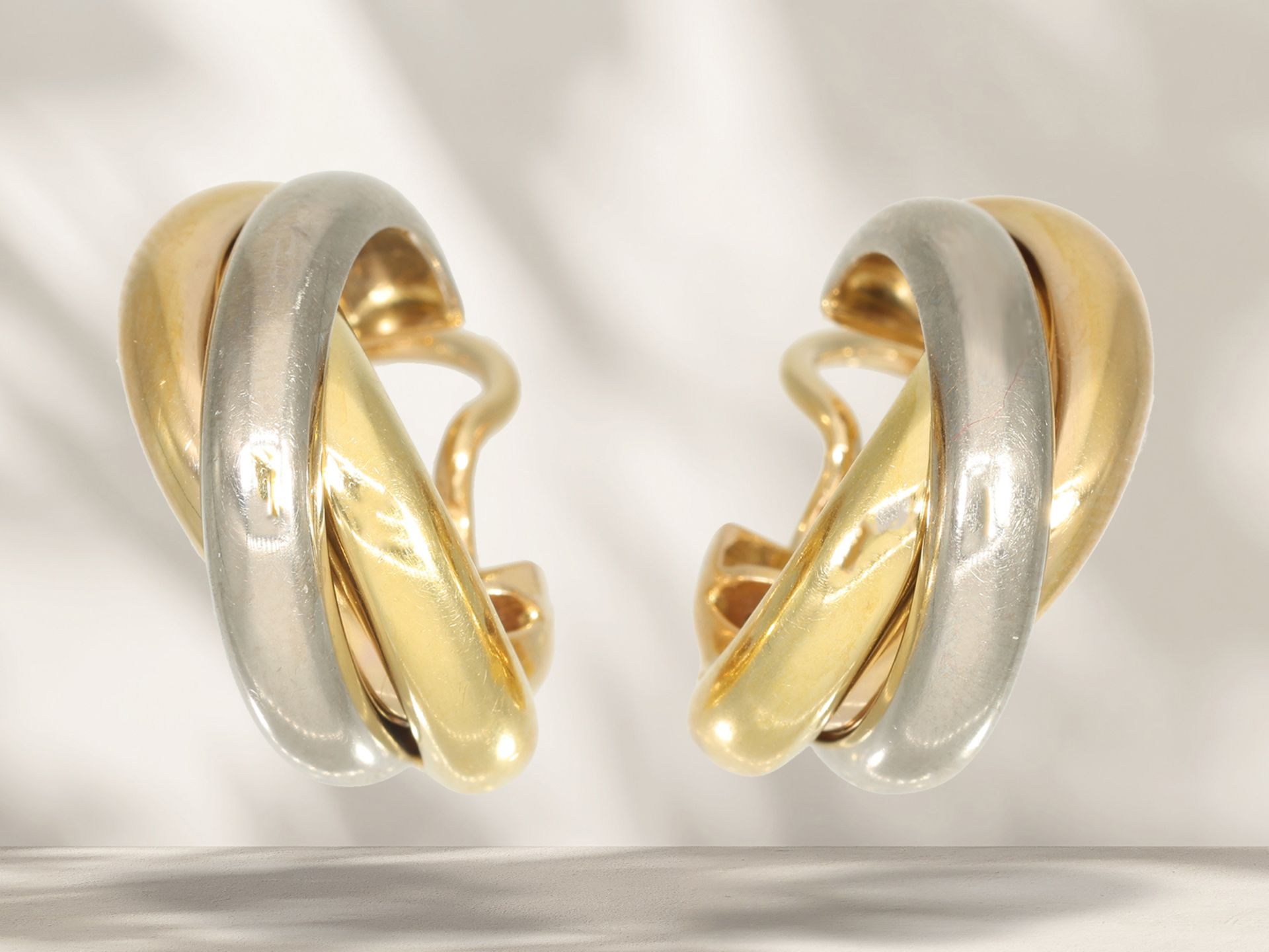 Earrings: high-quality designer hoop earrings by Cartier Paris, "Trinity", ca. 1990s