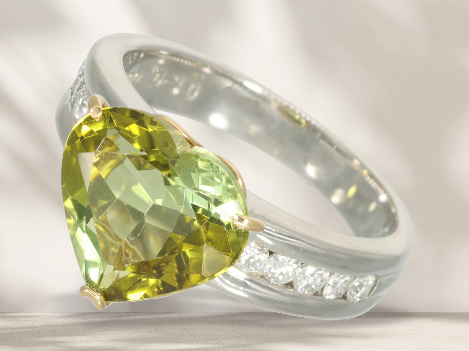 Ring: modern platinum ring with large green sphene (titanite) and brilliant-cut diamonds, like new