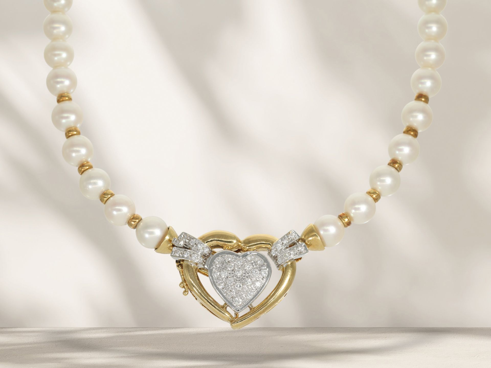 Valuable vintage cultured pearl necklace by Wempe with decorative 18K diamond clasp in heart shape