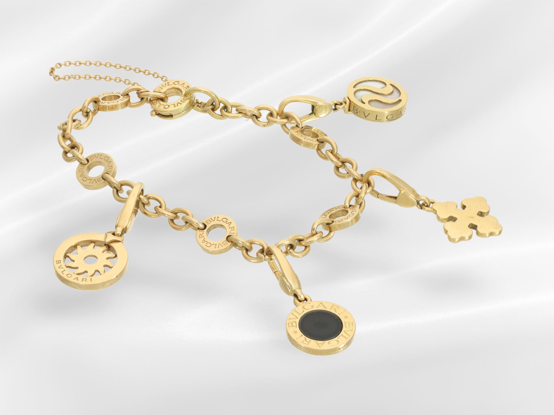 Bracelet: Bvlgari beggar's bracelet with 4 Bvlgari charms, box and papers