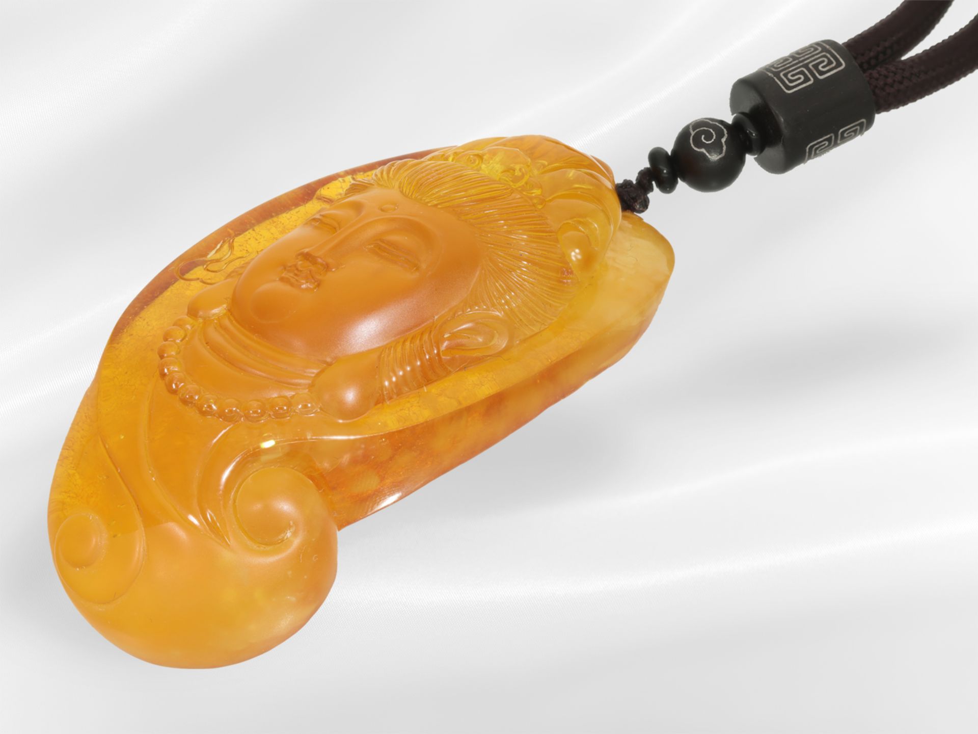 Chain/necklace: rare amber carving "Buddha", attached to fabric strap