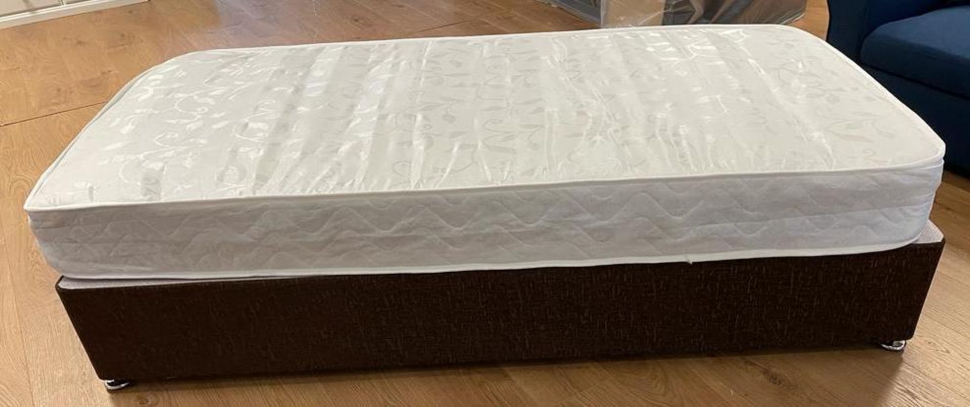 Brand New 4'6ft bed base in a light brown chenille with 800 pocket sprung Mattress.