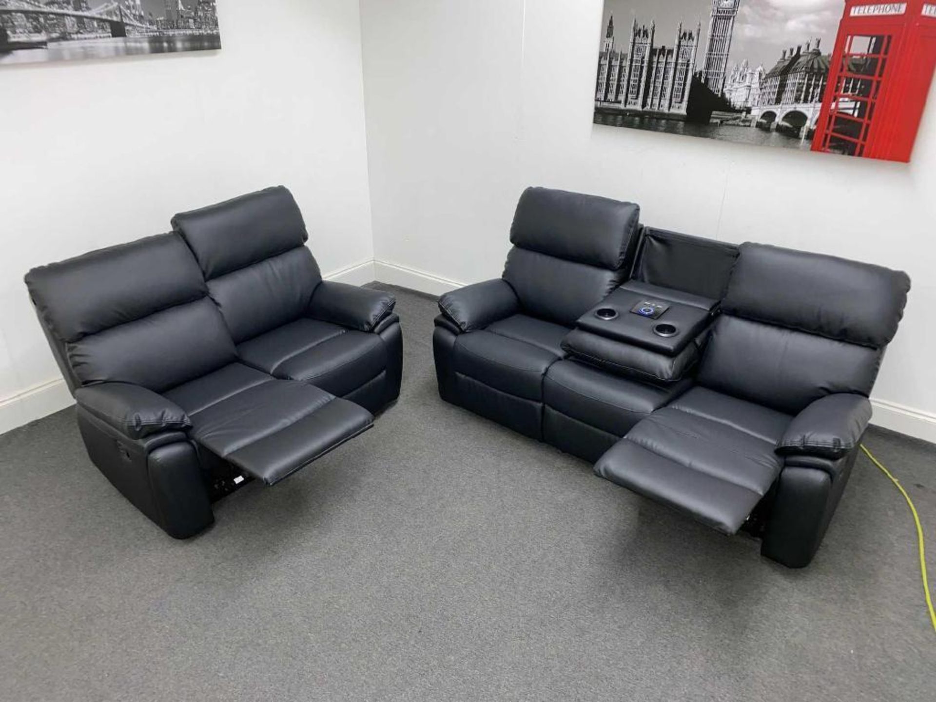 BRAND NEW stereo 3 + 2 seater leather manual reclining suite with stereo console. RRP: £1,999