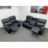 BRAND NEW stereo 3 + 2 seater leather manual reclining suite with stereo console. RRP: £1,999