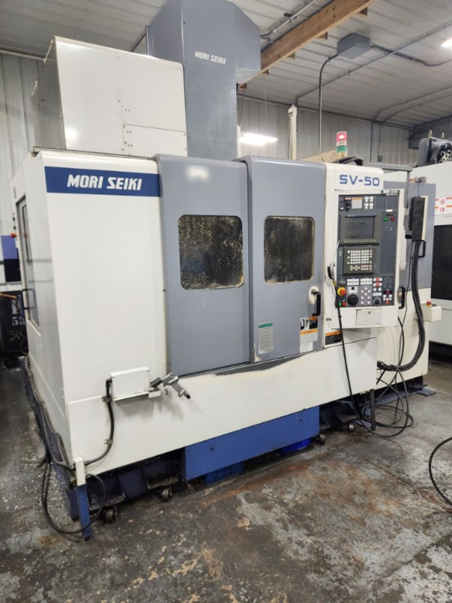 1999 Mori SV-50 Vertical CNC Mill w/ pallet changer, w/ SMW Rotary Indexer