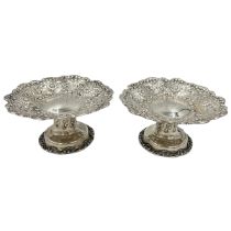A FINE PAIR OF TIFFANY AND CO. SILVER TAZZA WITH EMBOSSED DECORATION, CIRCA 1900
