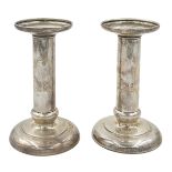 A PAIR OF STERLING OF SILVER CANDLESTICKS IN STYLISH MODERN MODE