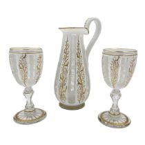 BOHEMIAN GLASS EWER AND CUPS WITH GILT HIGHLIGHTS