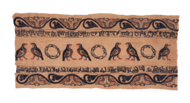 A KUFIC INSCRIBED TEXTILE WITH BIRDS, IN THE MANNER OF FATIMID, POSSIBLY 11TH CENTURY EGYPT