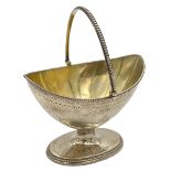 A GEORGIAN SILVER SWING HANDLE SUGAR BASKET RAISED ON A PEDESTAL FOOT, ROBERT HENNELL I, 1787