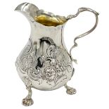 A VICTORIAN SILVER CREAM JUG WITH FLORAL DECORATION, LONDON, ROBERT HARPER, 1865