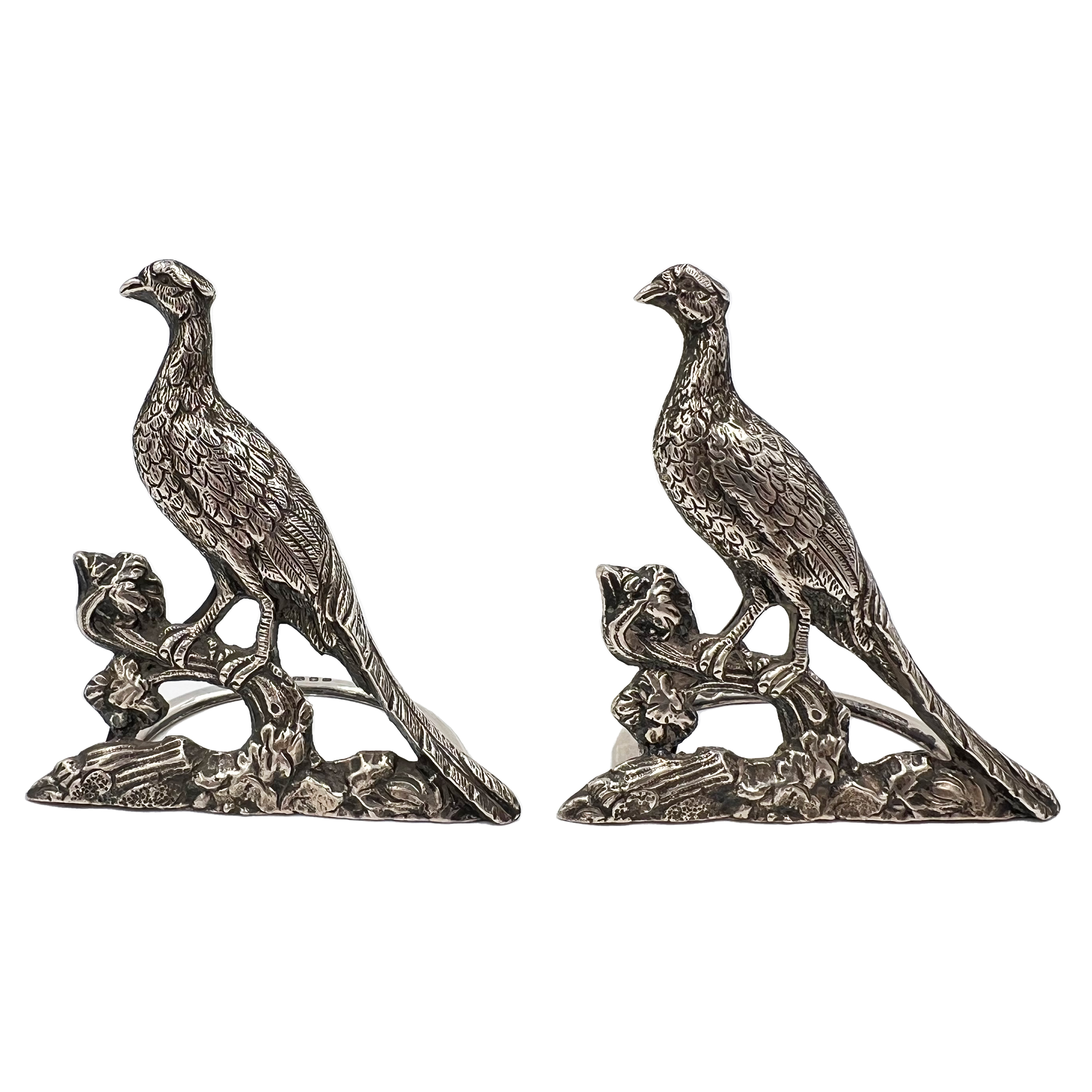 A GOOD QUALITY PAIR OF SILVER PHEASANT/GROUSE MENU HOLDERS, LONDON, VANDER & HEDGES, 1937