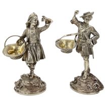 A STUNNING PAIR OF SOILD SILVER FIGURES DEPICTIONG A GENTLEMAN AND A LADY CARRYING BASKETS