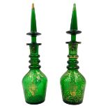 PAIR OF GREEN GLASS DECANTERS