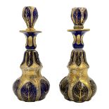 TWO BOHEMIAN GLASS PERFUME BOTTLES WITH BLUE AND GOLD GILDING