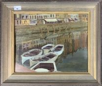 J.Simmons (20th century), View over moored boats and distant shops / buildings, oil on board,