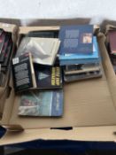 Two trays of mixed books including sailing, automobiles etc