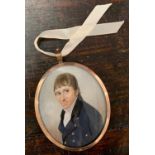 19th century, Regency Gentleman in a navy morning coat, oil miniature in oval, 5x6cm, framed and