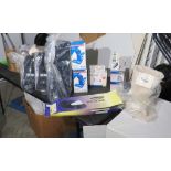 box of retail medical supplies – blood pressure wrist monitors, insulin protectors, insulin syrin...