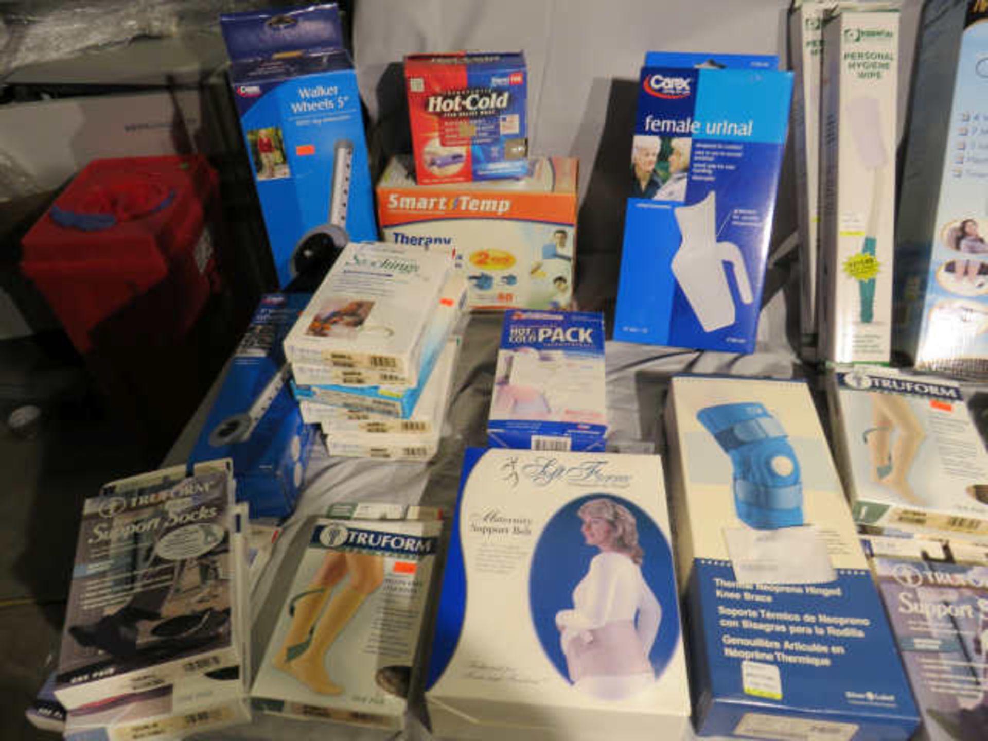 new drug store items including heat pads, support bands, braces, socks, urinals, - Image 4 of 4