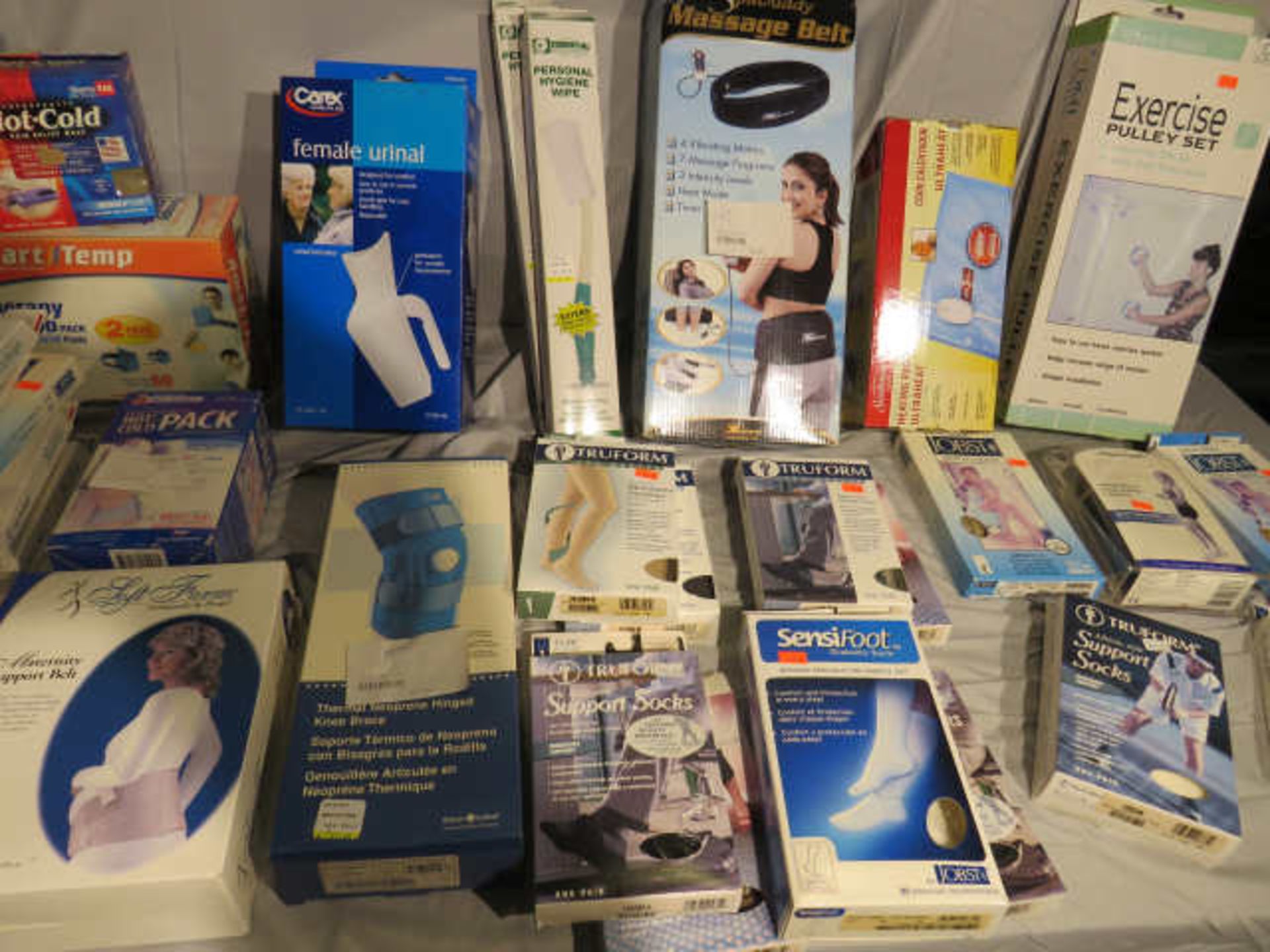 new drug store items including heat pads, support bands, braces, socks, urinals, - Image 3 of 4