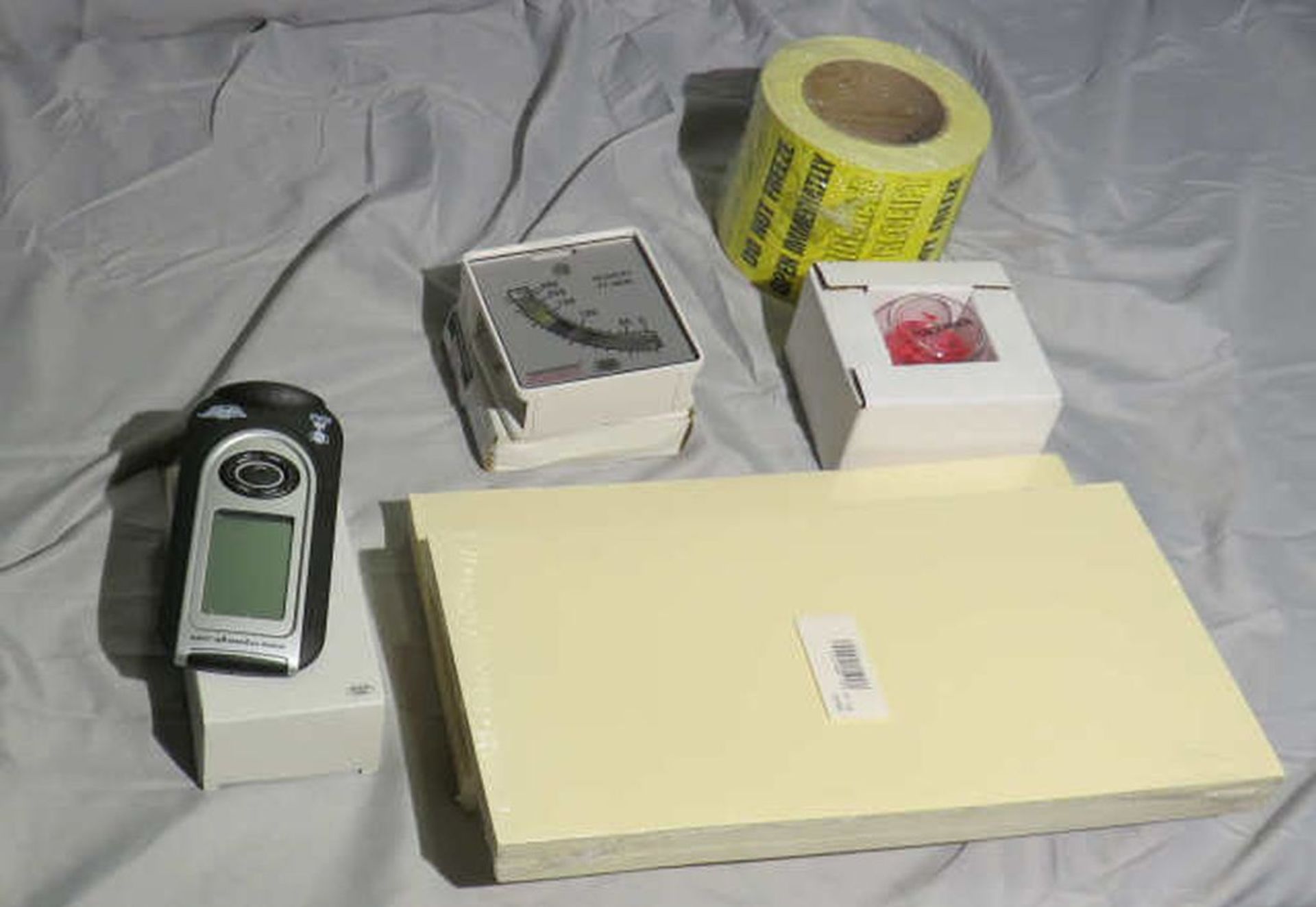 new supplies cardboard, scale, gauge roll of do not freeze tape