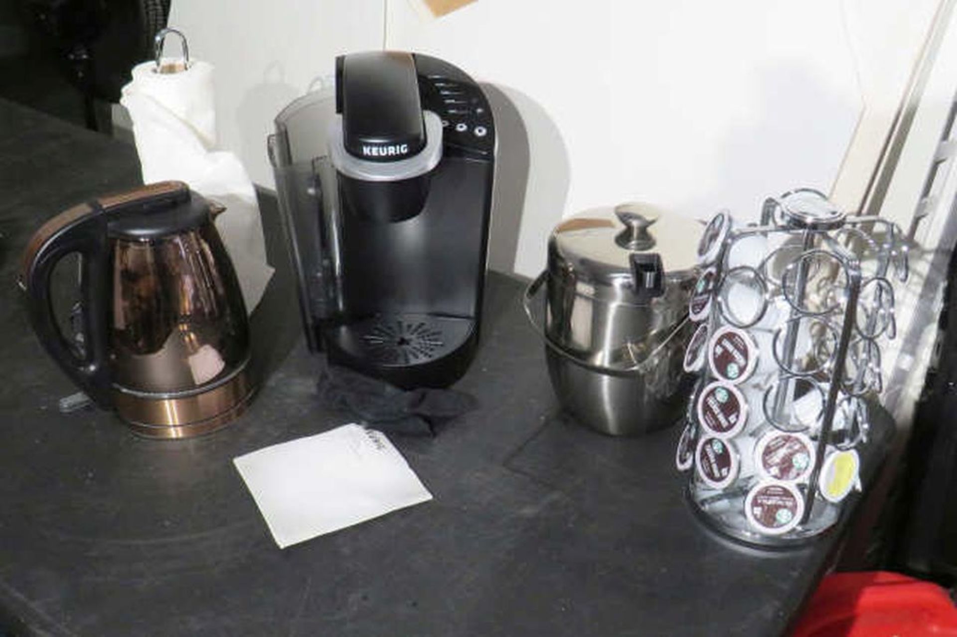 Keurig coffee maker with pitcher, towel rack and coffee rack