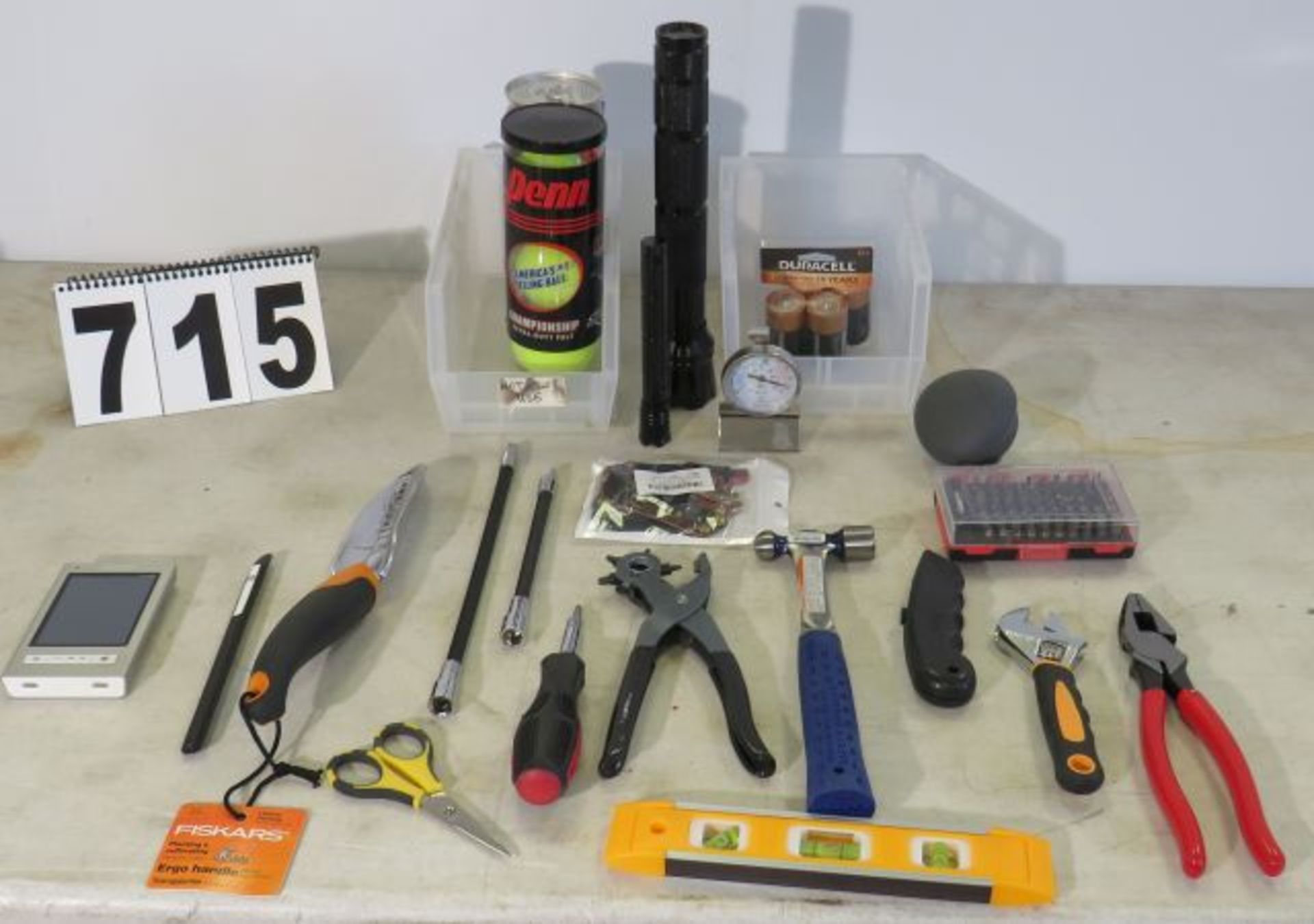 mixed tools, flashlights, tennis balls, oven temp gauge