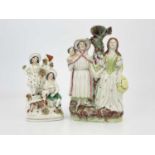 Two Staffordshire figures, including the Gypsy Fortune Teller, with applied grass tufts, and