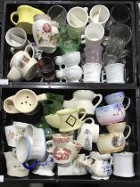 A Collection of 19th century and 20th century shaving mugs to include American glass shaving mugs,