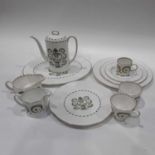 A Susie Cooper Assyrian pattern part coffee and dinner service, decorated with stylised urns and