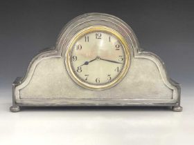 Liberty and Co., an Arts and Crafts Tudric pewter clock, model 01492, planished double ogee domed