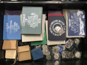 A collection of British coins and commemorative coins, including sterling silver 1977 cased