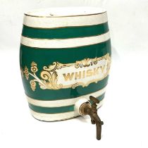 A vintage ceramic whisky barrel, green bands, gilt border, and lettering, with cover, 34cm high (s.