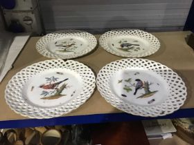 A set of four Meissen reticulated ornithological plates, each painted with a bird study perched on a