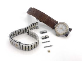 Dunhill, a stainless steel and gold plated watch with a circular dial with date aperture, on a