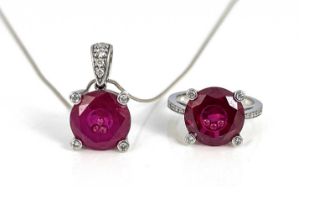 A 14k gold pendant and ring, each set synthetic ruby inset with three white stones, ring size N 1/