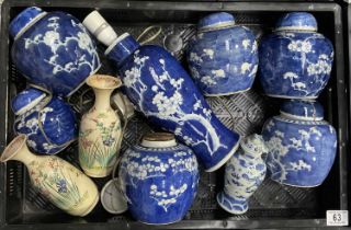 A collection of Chinese blue and white ginger jars, each decorated with flowering prunus branches,