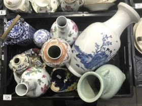 A collection of Chinese porcelain, including a blue and white vase, teapot with brass handle, pair