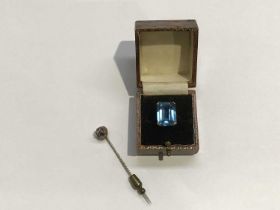 A 9ct gold blue tourmaline emerald cut dress ring, together with an amethyst set stickpin with