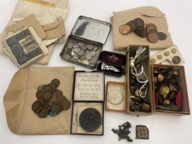 A collection of 20th century British military cap badges and buttons, including The West Riding,
