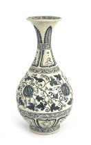 A Chinese blue and white vase, baluster form, painted with pomegranates in foliate scroll ground,