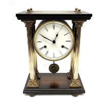 A French bracket clock, of architectural form with a colonnade of four Corinthian columns, 15cm