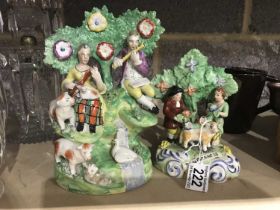 A Staffordshire bocage arbor group, circa 1830, modelled as musicians seated on a river bank with