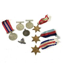 A collection of World War Two medals, including The 1939-1945 Star, The Italy Star, The France and