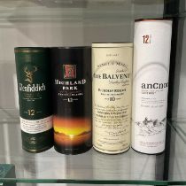 Four bottles of cased whisky, including Highland Park Orkney Islands Single Malt Scotch Whisky, aged