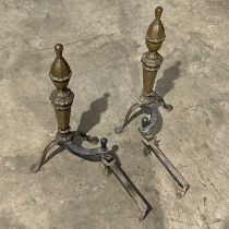 A pair of brass iron fireplace andirons. L: 50 cm H: 65 cm