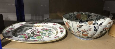 An Imari circular bowl, with lobed rim, decorated with flowers and leaves, together with and