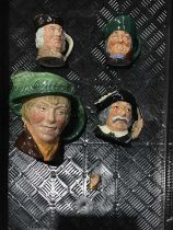 Four Royal Doulton character jugs, 'arriet' 14cm high, Sancho Panca, 10cm high; Toby Phillpots 8cm