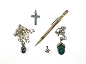 A selection of jewellery and a pencil